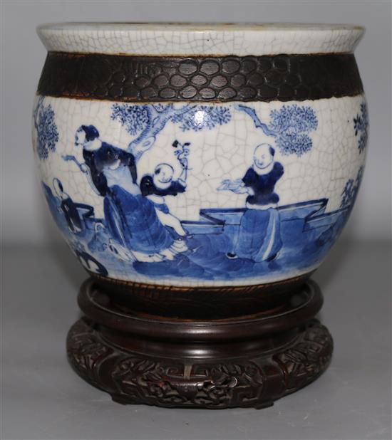 A Chinese blue and white jardiniere, wood stand